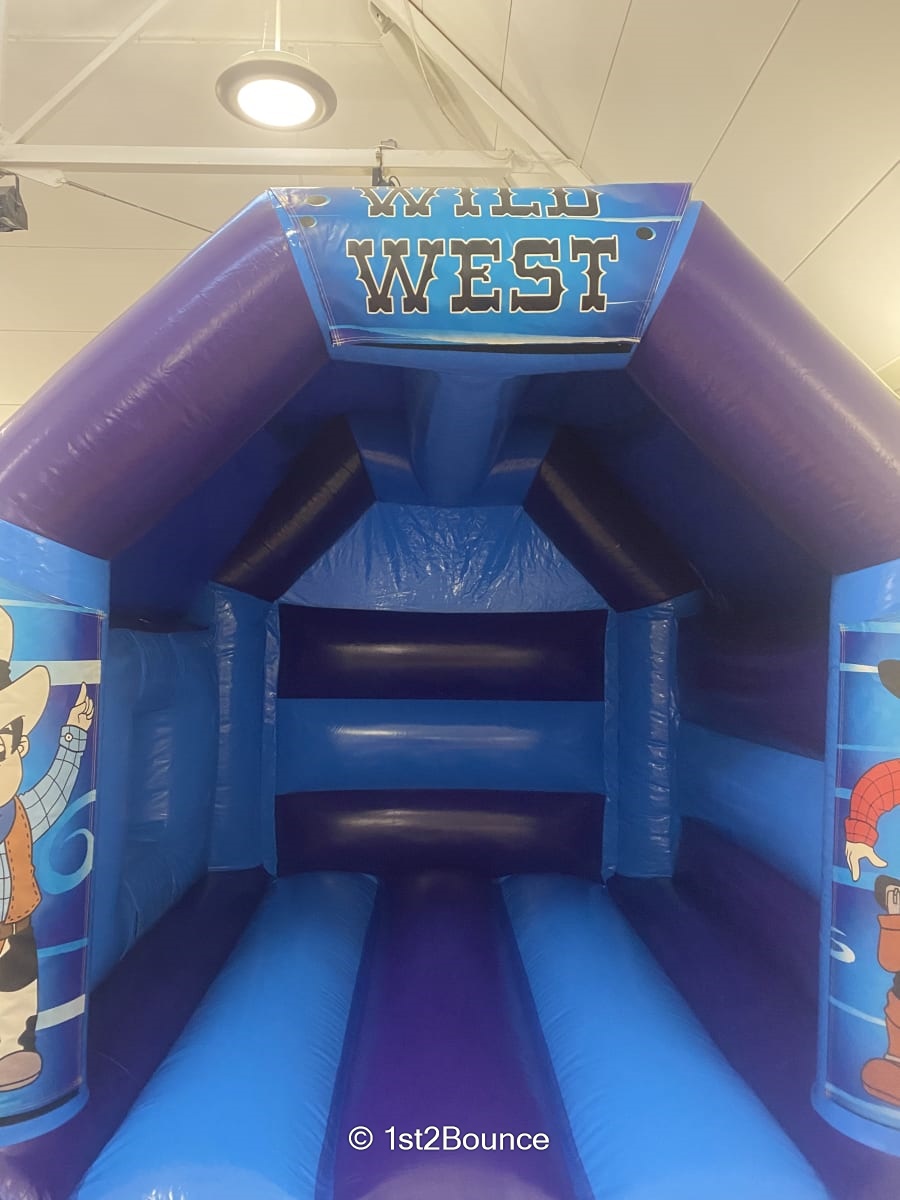 Wild West Side Slide Bouncy Castle Best Bouncy Castle Hire service in