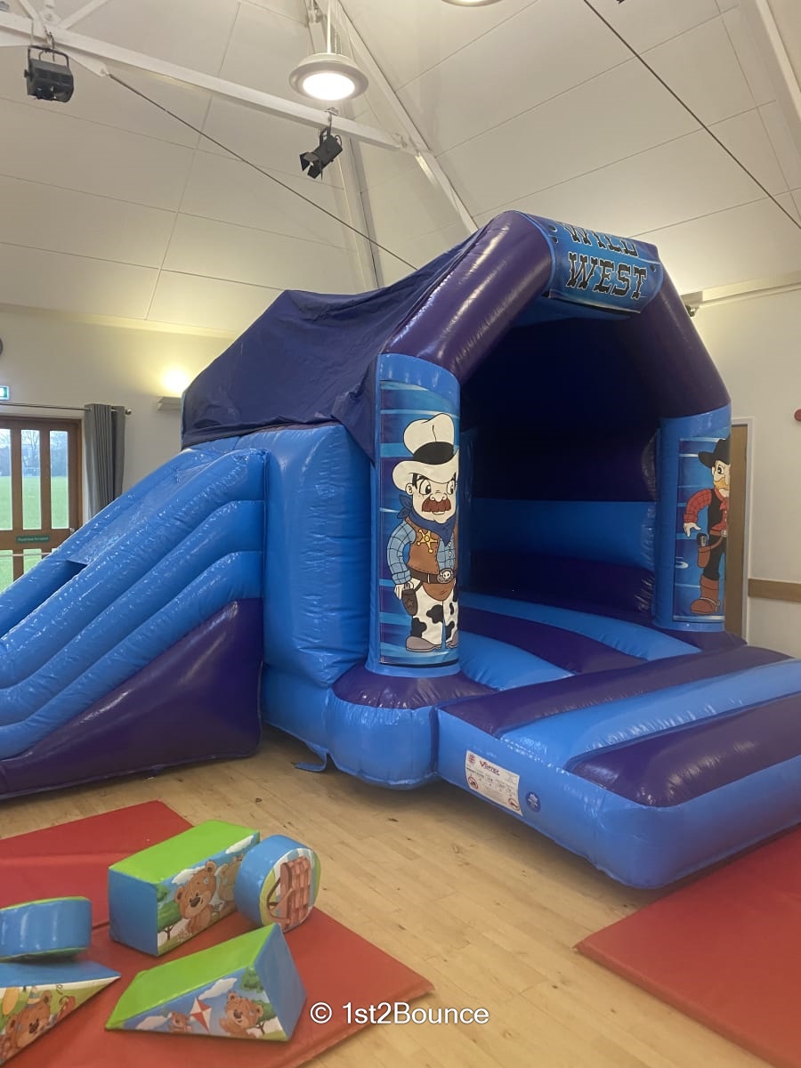 Wild West Side Slide Bouncy Castle Best Bouncy Castle Hire service in